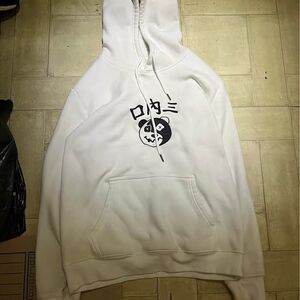 white pullover hoodie features a graphic of a panda face size large